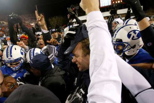 Coach Bronco Mendenhall and the Cougars celebrate their 44-20 victory over Oregon State.

Chris Detrick | The Salt Lake Tribune