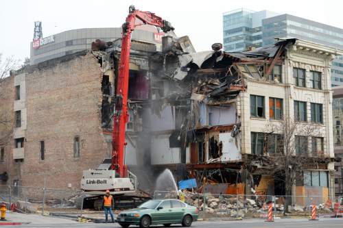 Steve Griffin  |  The Salt Lake Tribune
Crews demolish the Arrow Press Square building  in Salt Lake City on Thursday. The building was built in 1908 and was home to various businesses including restaurants, a radio station and the Dead Goat Saloon.