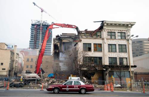 Steve Griffin  |  The Salt Lake Tribune

Crews demolish the Arrow Press Square building  in Salt Lake City, Thursday, December 3, 2015. The building was built in 1908 and was home to various businesses including restaurants, a radio station and the Dead Goat Saloon.
