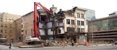 Steve Griffin  |  The Salt Lake Tribune

Crews demolish the Arrow Press Square building  in Salt Lake City, Thursday, December 3, 2015. The building was built in 1908 and was home to various businesses including restaurants, a radio station and the Dead Goat Saloon.