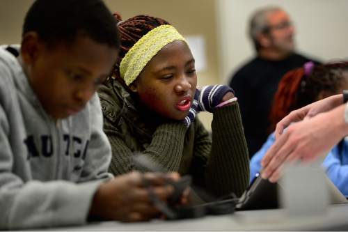 Scott Sommerdorf   |  The Salt Lake Tribune
Dusenge Raheli, one of sixty young Utah refugees takes part in a coding demonstration using "Minecraft" as an example program. Raheli was one of 250 students to get a crash course in coding at Adobe, Inc.'s Lehi campus, Saturday, December 5, 2015.