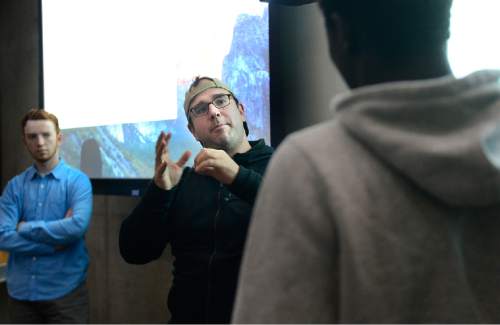 Scott Sommerdorf   |  The Salt Lake Tribune
Stephane Jacobs of Cotopaxi was one of the volunteers helping to teach sixty young Utah refugees who were among 250 students to get a crash course in coding at Adobe, Inc.'s Lehi campus, Saturday, December 5, 2015.