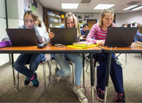 Steve Griffin  |  The Salt Lake Tribune

Eighth graders Julianne Adams, Kandus Hullinger and Brandee Clark, use tablets as they learn about Anne Frank in Melinda Johnston's english class at Pleasant Grove Junior High School in Pleasant Grove, Utah Thursday, November 12, 2015.