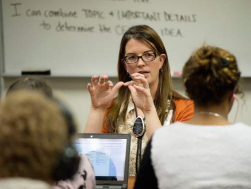 Steve Griffin  |  The Salt Lake Tribune

Melinda Johnston works with her 8th grade English class Pleasant Grove Junior High School as they use tablets to learn about Anne Frank in Pleasant Grove, Thursday, November 12, 2015.