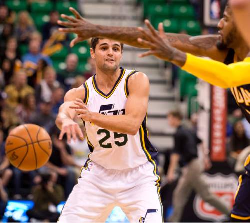 Lennie Mahler  |  The Salt Lake Tribune

Jazz guard Raul Neto passes through the hands of Indiana's Paul George in the first half of an NBA basketball game at Vivint Smart Home Arena on Saturday, Dec. 5, 2015.