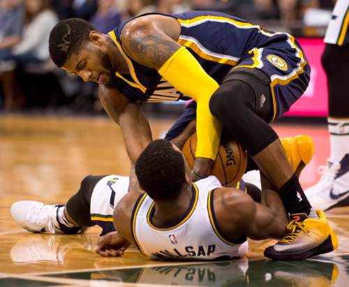 Lennie Mahler  |  The Salt Lake Tribune

Paul George ties up Elijah Millsap to force a jump ball in the first half of an NBA basketball game at Vivint Smart Home Arena on Saturday, Dec. 5, 2015.