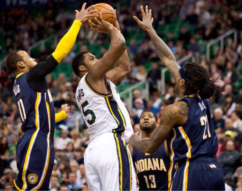 Lennie Mahler  |  The Salt Lake Tribune

Derrick Favors is blocked by Indiana Pacers guard Monta Ellis as Paul George and Jordan Hill defend in the first half of an NBA basketball game at Vivint Smart Home Arena on Saturday, Dec. 5, 2015.