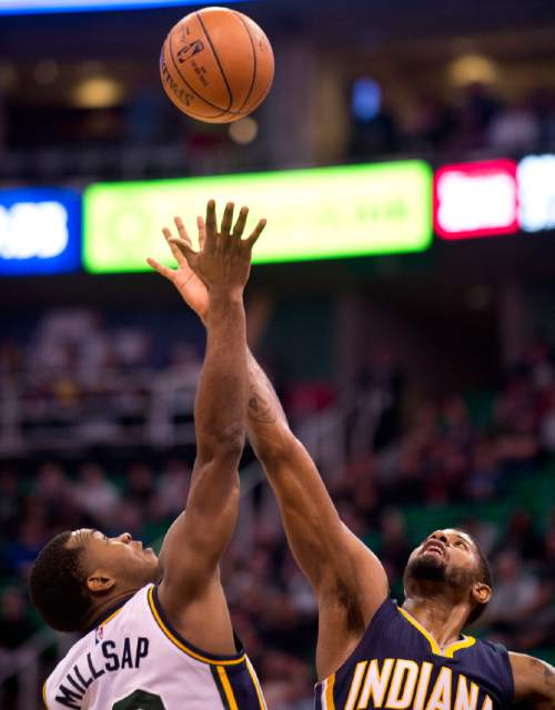 Lennie Mahler  |  The Salt Lake Tribune

Elijah Millsap and Paul George jump for the ball in the first half of an NBA basketball game at Vivint Smart Home Arena on Saturday, Dec. 5, 2015.