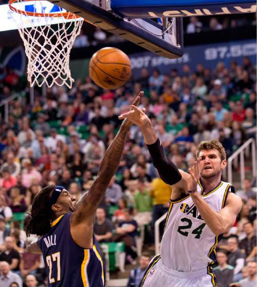 Lennie Mahler  |  The Salt Lake Tribune

Jazz forward Jeff Withey kicks the ball out past Indiana Pacers forward Jordan Hill in the first half of an NBA basketball game at Vivint Smart Home Arena on Saturday, Dec. 5, 2015.
