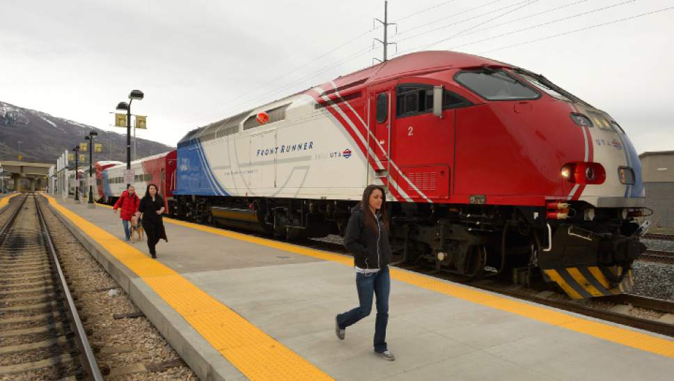 Rick Egan  |  Tribune file photo
Passengers exit the FrontRunner at Farmington Station in 2014. The Utah Transit Authority plans to improve oversight of transit-oriented developments following critical audits.