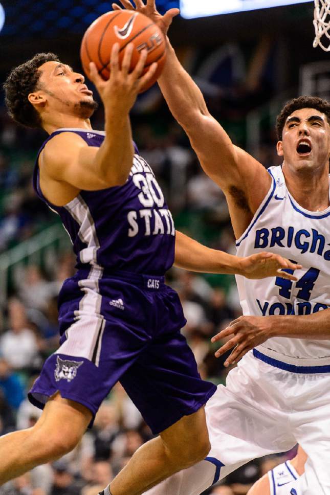Trent Nelson  |  The Salt Lake Tribune
Weber State's Jeremy Singling drives on BYU's Corbin Kaufusi, as BYU faces Weber State, NCAA basketball at Vivant Smart Home Arena in Salt Lake City, Saturday December 5, 2015.