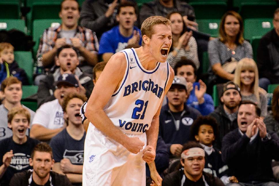 Trent Nelson  |  The Salt Lake Tribune
BYU's Kyle Davis lets out a cougar roar as BYU faces Weber State, NCAA basketball at Vivant Smart Home Arena in Salt Lake City, Saturday December 5, 2015.