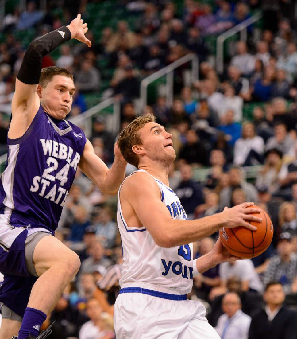 Trent Nelson  |  The Salt Lake Tribune
BYU's Jake Toolson is pursued by Weber State's McKay Cannon as BYU faces Weber State, NCAA basketball at Vivant Smart Home Arena in Salt Lake City, Saturday December 5, 2015.