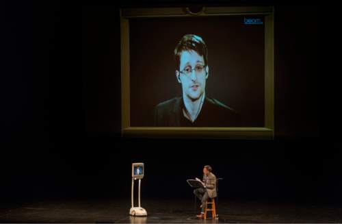Rick Egan  |  The Salt Lake Tribune

Edward Snowden speaks live via satellite to a Park City audience, moderated by Doug Fabrizio, at the Eccles Center in Park City, Saturday, December 5, 2015.