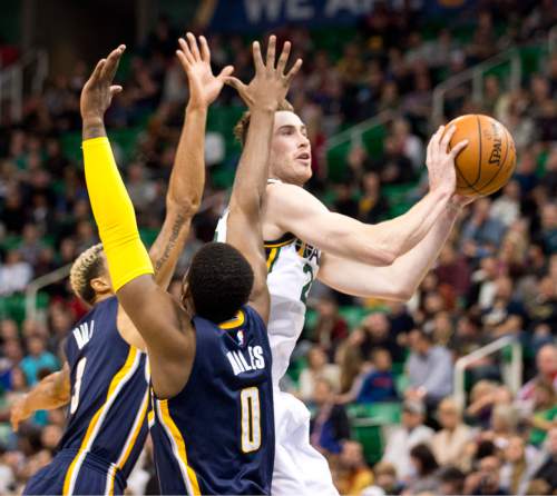 Lennie Mahler  |  The Salt Lake Tribune

Gordon Hayward shoots over Indiana Pacers George Hill and C.J. Miles in the first half of an NBA basketball game at Vivint Smart Home Arena on Saturday, Dec. 5, 2015.