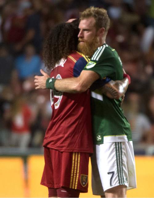 Rick Egan  |  The Salt Lake Tribune

Real Salt Lake midfielder Luke Mulholland (19) hugs Portland Timbers Nat Borchers (7) after the game, in MLS action Real Salt Lake vs. The Portland Timbers, at Rio Tinto stadium, Saturday, August 15, 2015.