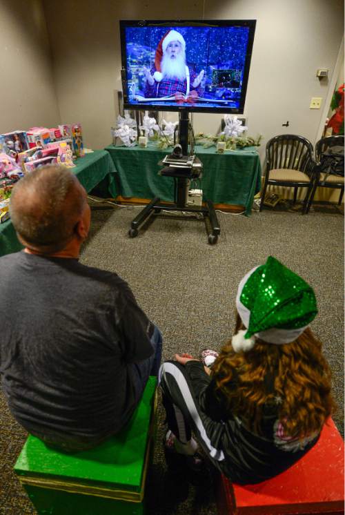 Francisco Kjolseth | The Salt Lake Tribune
The Shriners Hospital for Children in Salt Lake has a video chat with Santa Claus through the magic of collaboration technology. Lillian Taylor, 9, of Elko Nevada who is a patient at the hospital along with her sister, is joined by her father Paul as she chats with Santa during a broadcast from the "North Pole." Much like children who are able to sit on Santa's lap, patients were given the opportunity to interact directly with Santa and pass along their wishes this holiday season. This is an example of how technology can be used to improve lives and bring a little happiness to sick kids during the holidays. Dimension Data provided the video chat technology in Utah and for Shriners Hospitals for Children nationwide.