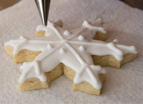 Rick Egan  |  The Salt Lake Tribune

Kristen Fenton, owner of Just Iced Cookies, cuts out  holiday sugar cookies in her home, Thursday, Dec. 3, 2015.