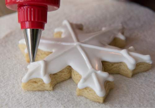 Rick Egan  |  The Salt Lake Tribune

Kristen Fenton, owner of Just Iced Cookies, cuts out  holiday sugar cookies in her home, Thursday, Dec. 3, 2015.