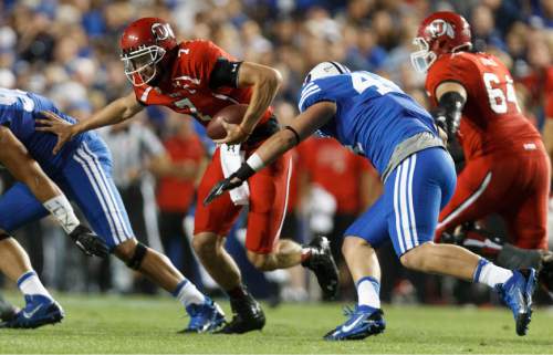 Trent Nelson  |  The Salt Lake Tribune
Brigham Young Cougars defensive lineman Remington Peck (44) sacks Utah Utes quarterback Travis Wilson (7) in the first quarter as the BYU Cougars host the Utah Utes, college football Saturday, September 21, 2013 at LaVell Edwards Stadium in Provo.