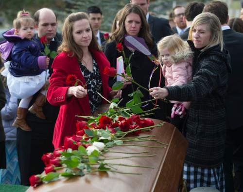 Steve Griffin  |  The Salt Lake Tribune

Family and friends place roses on the casket of former Gov. Olene Walker during graveside services for the beloved former governor Friday, December 4, 2015.