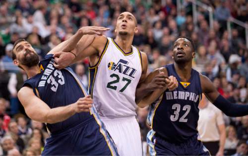Lennie Mahler  |  The Salt Lake Tribune

Memphis center Marc Gasol, Utah center Rudy Gobert, and Memphis forward Jeff Green fight for a rebound in the first half of a game at Vivint Smart Home Arena on Saturday, Nov. 7, 2015.