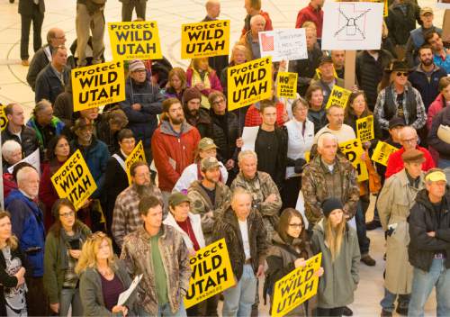 Rick Egan  |  The Salt Lake Tribune

Lawmakers and environmental and public lands advocates rally against the public lands transfer in the capitol rotunda, Monday, March 2, 2015