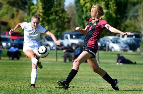 Scott Sommerdorf   |  The Salt Lake Tribune
Davis' Olivia Wade lets rip with a shot as Viewmont's Grace Johnson defends during first half play. Davis defeated Viewmont 5-2, Thursday, September 10, 2015.