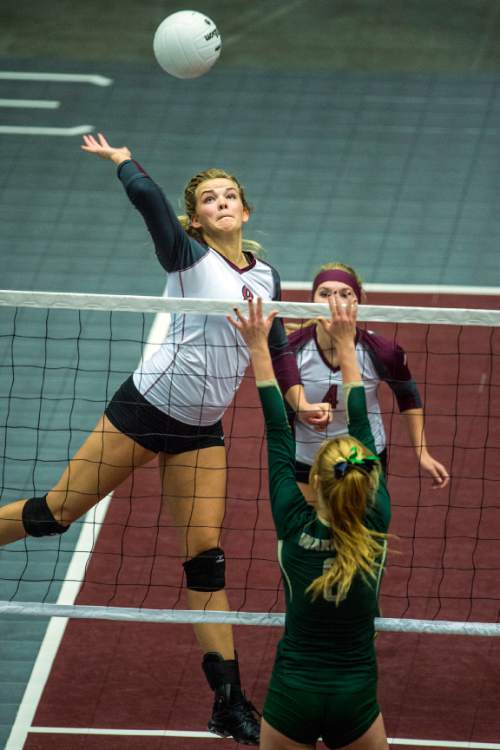 Chris Detrick  |  The Salt Lake Tribune
Morgan's Aubrey Saunders (8) spikes the ball past Snow Canyon's Nikenna Durante (9) during the 3A championship match at the UCCU Center Thursday October 29, 2015.