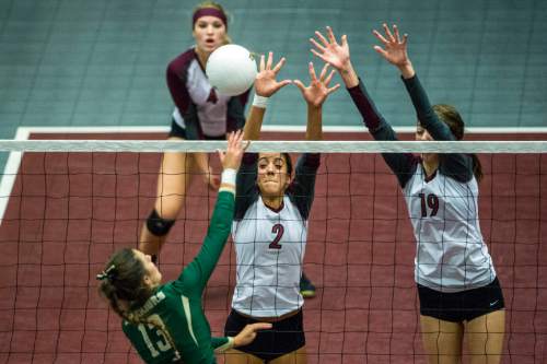 Chris Detrick  |  The Salt Lake Tribune
Morgan's Jorry Randall (2) and Anna Cox (19) go up to block Snow Canyon's Alexsa Parker's (13) spike during the 3A championship match at the UCCU Center Thursday October 29, 2015.