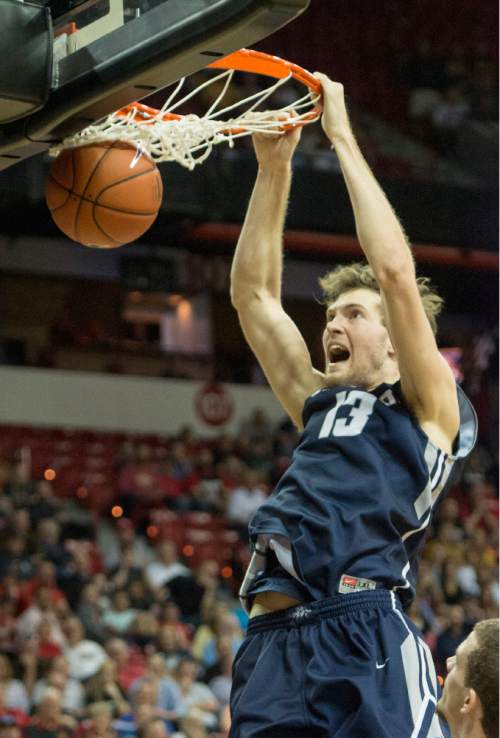 Rick Egan  |  The Salt Lake Tribune

Utah State forward David Collette (13) dunks the ball for the Aggies in Mountain West Conference Basketball Championship action, Utah State vs. Wyoming, at the Thomas & Mack Center in Las Vegas, Thursday, March 12, 2015.