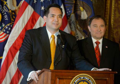 Keith Johnson | The Salt Lake Tribune

Utah Governor Gary Herbert, right, announces Sean Reyes as Utah's new Attorney General, December 23, 2013. Reyes takes office after former Attorney General John Swallow resigned amid allegations of impropriety.