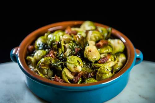 Chris Detrick  |  The Salt Lake Tribune
Bruselas con Tocino (brussels sprouts) with applewood smoked bacon and sherry cream ($10) at Finca on Nov. 18, 2015.