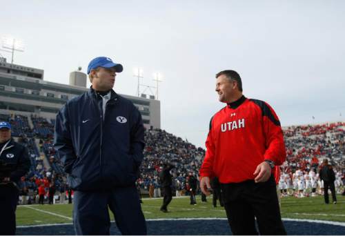 Chris Detrick | The Salt Lake Tribune

BYU head coach Bronco Mendenhall and Utah head coach Kyle Whittingham meet at the center of the field before the start of the BYU Utah game at Lavell Edwards Stadium in Provo, Utah, Saturday, November 28, 2009.