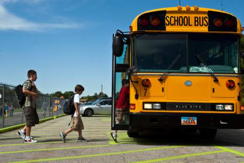 Chris Detrick  |  The Salt Lake Tribune
Students get onto the school bus after school at Liberty Elementary School in August 2011. Utah's school-bus fleet is a lot cleaner, with the completion of a diesel retrofit program that has updated 1,200 buses over the past four years.