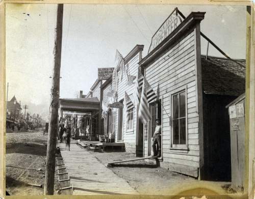 Tribune file photo

A handwritten note on the back of this photo of Park City dated July 4, 1885, says: "R.E. Squire in door almost opposite City Hall. Formerly Queen City Restaurant run by Reddy [illegible word] Robinson. [illegible word] ran Silver Queen Restaurant in Jerry Mason Building best in town 1883. Jas. P. Burns boarded there with his uncle Pat J. Brennan."