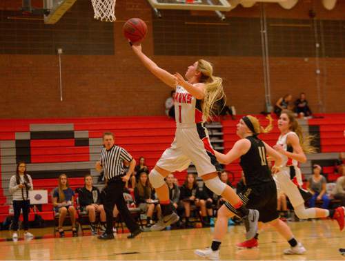 Leah Hogsten  |  The Salt Lake Tribune
Alta's Mariah Martin gets the steal for two. Alta High School girls basketball defeated Lone Peak High School, 79-47 Tuesday, December 8, 2015.