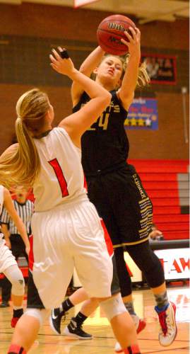 Leah Hogsten  |  The Salt Lake Tribune
Lone Peak's Brooke Peterson pulls down the rebound. Alta High School girls basketball defeated Lone Peak High School, 79-47 Tuesday, December 8, 2015.