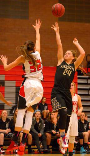 Leah Hogsten  |  The Salt Lake Tribune
Lone Peak's Brooke Peterson hits the net over Alta's Trista Vawdrey. Alta High School girls basketball defeated Lone Peak High School, 79-47 Tuesday, December 8, 2015.
