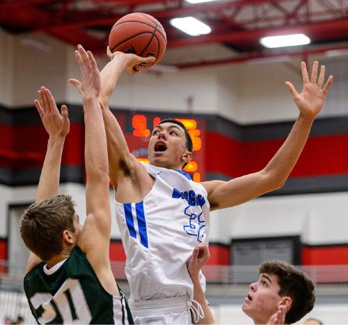 Trent Nelson  |  The Salt Lake Tribune
Bingham's Samuta Avea (32) puts up a shot over Olympus's Isaac Monson (20), as Bingham plays Olympus in the first round of the boys' basketball Elite 8 Tournament at American Fork High School, Thursday December 10, 2015.