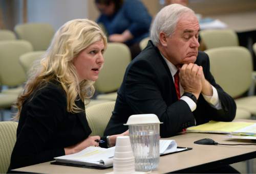 Al Hartmann  |  The Salt Lake Tribune
Julia Kyte, lawyer for San Juan Commissioner Phil Lyman, left and Blaine Ferguson with the Utah Attorney General's office speak before the Utah State Records Committee, a non-judicial panel that hears appeals on public records Thursday Dec. 10 in Salt Lake City.  The Utah attorney general's office has asked for an unprecedented closed-door hearing and deliberations on a records dispute with The Salt Lake Tribune. At issue are records from the closed conflict-of-interest investigation of San Juan County Commissioner Phil Lyman.
The committee ordered the Utah Attoney General's office to provide The Tribune with records from a closed criminal investigation into San Juan County Commissioner Phil Lyman ó if there are any records.