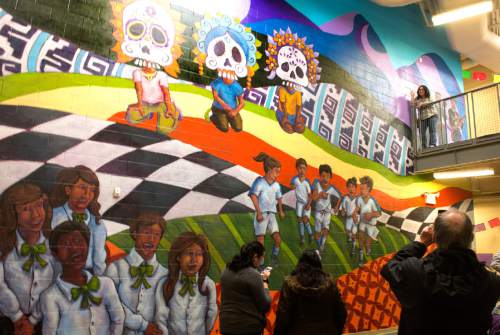 Rick Egan  |  The Salt Lake Tribune

Artists and teachers gather as University of Utah professor V. Kim Martinez unveiled an1500 square foot mural at Esperanza Elementary School in West Valley City, Friday, December 11, 2015.