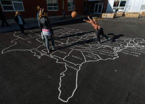 Francisco Kjolseth | The Salt Lake Tribune
At Open Classroom Charter school in the avenues, students play various games during recess. A legislative task form is recommending changes to the way Utah's charter schools are funded.