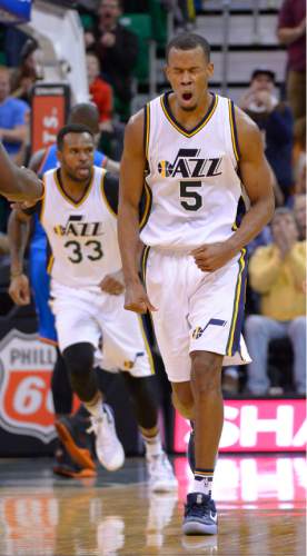 Leah Hogsten  |  The Salt Lake Tribune
Utah Jazz guard Rodney Hood (5) reacts to knocking down a shot over Oklahoma City Thunder guard Dion Waiters (3). Oklahoma City Thunder defeated the Utah Jazz 94-90 at Vivint Smart Home Arena, Friday, December 11, 2015.