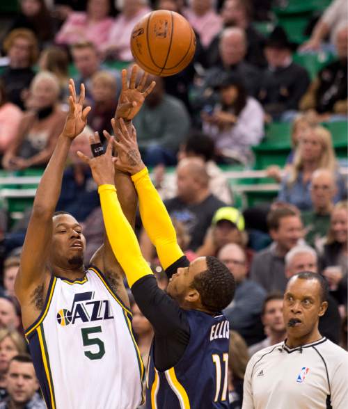 Lennie Mahler  |  The Salt Lake Tribune

Jazz guard Rodney Hood shoots over Indiana Pacers guard Monta Ellis in the first half of an NBA basketball game at Vivint Smart Home Arena on Saturday, Dec. 5, 2015.
