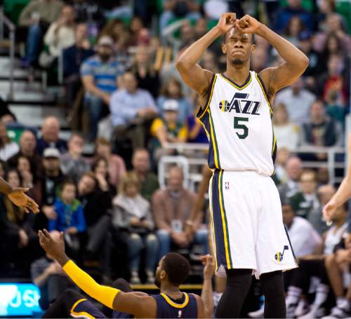 Lennie Mahler  |  The Salt Lake Tribune

Rodney Hood grimaces after fouling Pacers guard C.J. Miles behind the three-point line in the first half of an NBA basketball game at Vivint Smart Home Arena on Saturday, Dec. 5, 2015.