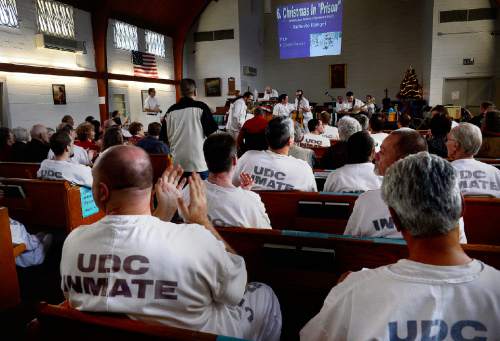 Scott Sommerdorf   |  The Salt Lake Tribune
Inmates listen in the prison's chapel during the annual Christmas concert of the Wasatch Music Education Program at the Utah State Prison on Saturday, Dec. 12, 2015.