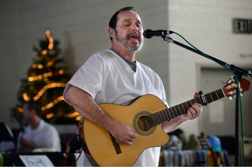 Scott Sommerdorf   |  The Salt Lake Tribune
Thomas Justet performs "Christmas in Love" at the annual Christmas concert of the Wasatch Music Education Program at the Utah State Prison on Saturday, Dec. 12, 2015.