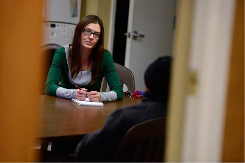 Scott Sommerdorf   |  The Salt Lake Tribune
Nicole Lowe meets with a homeless man at the VOA homeless youth center on State Street, Thursday, December 10, 2015. Lowe was once homeless and a drug user. Now she is an attorney with the A.G.'s office. She donates her own time to help homeless people with legal issues.