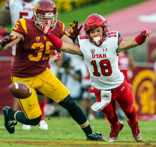 Chris Detrick  |  The Salt Lake Tribune
Utah Utes wide receiver Britain Covey (18) and USC Trojans linebacker Cameron Smith (35) dive for the ball during the game at the Los Angeles Memorial Coliseum Saturday October 24, 2015.